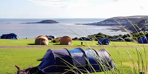 Enjoys the sea views at Bay View Farm Camping Site overlooking Looe Bay, Cornwall
